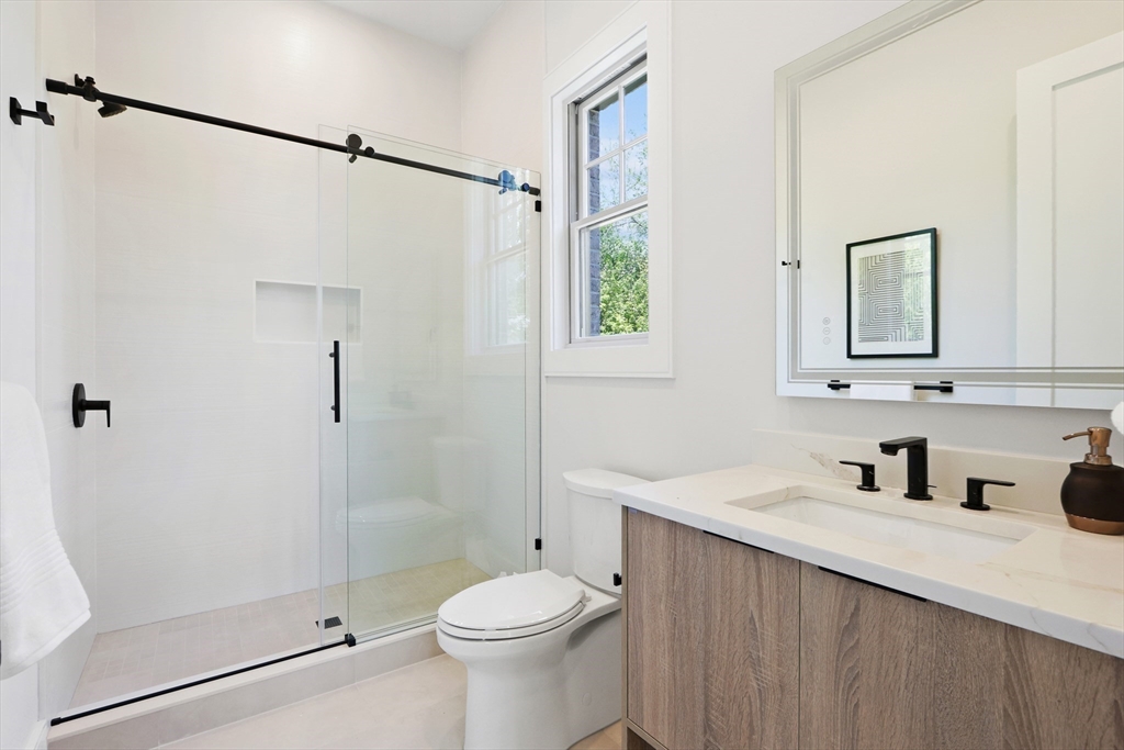 35 Mignon Road Newton, MA 02465 - Photo 30 of 42 a bathroom with a sink and a mirror