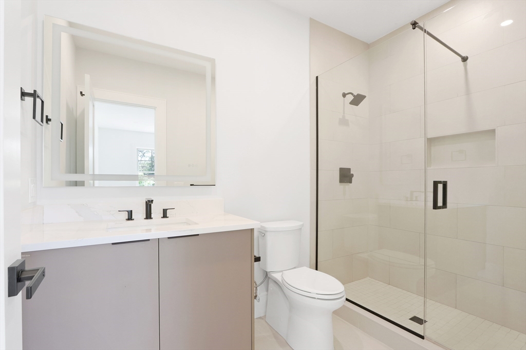 35 Mignon Road Newton, MA 02465 - Photo 34 of 42 a bathroom with a sink a toilet and shower