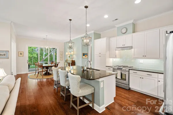 a large kitchen with kitchen island a large island in the center