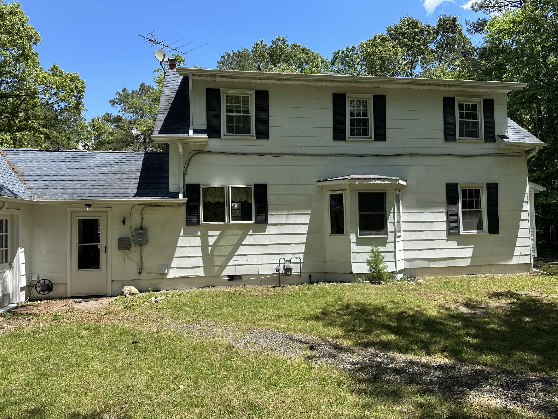 317 Magnolia Road Pemberton, NJ 08068 - Photo 5 of 42 front view of a house with a yard