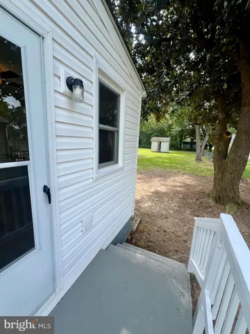 a swimming pool with outdoor seating and yard