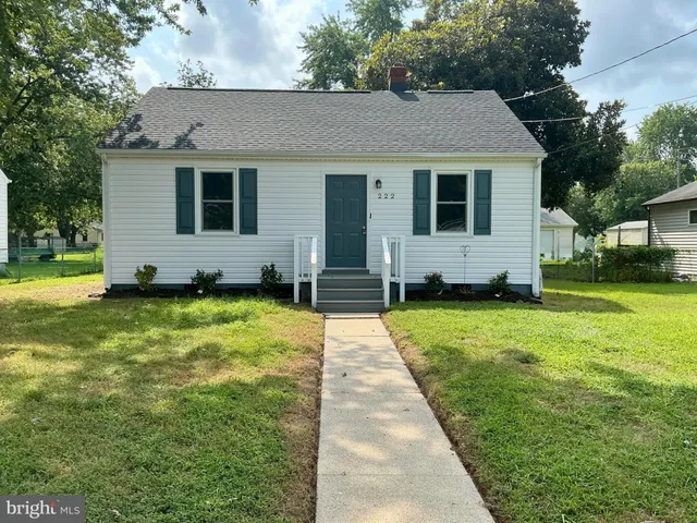 a view of a yard with a house and garden