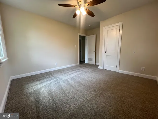 a view of backyard with green space