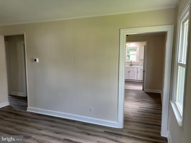 an empty room and wooden door