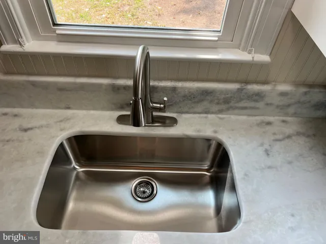 a close view of sink and mirror