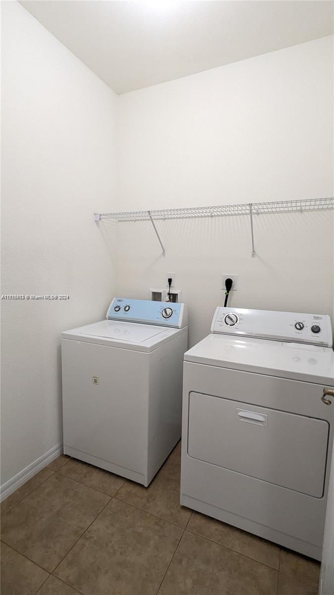 11840 Southwest 154th Avenue, Unit 11840 Miami, FL 33196 - Photo 12 of 61 a utility room with dryer and washer
