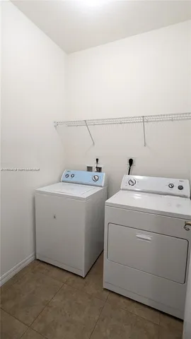 a view of room that has a utility room