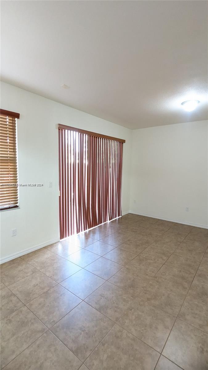 11840 Southwest 154th Avenue, Unit 11840 Miami, FL 33196 - Photo 17 of 61 an empty room with windows