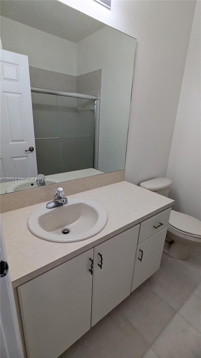 11840 Southwest 154th Avenue, Unit 11840 Miami, FL 33196 - Photo 34 of 61 a bathroom with a sink and a toilet