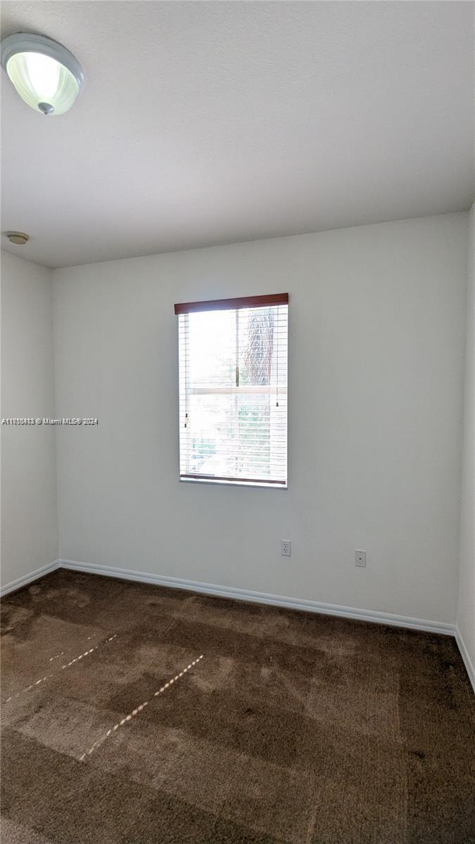 11840 Southwest 154th Avenue, Unit 11840 Miami, FL 33196 - Photo 43 of 61 an empty room with a window