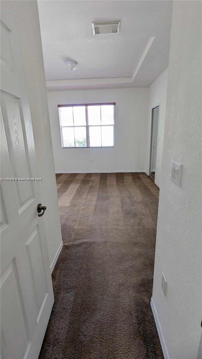 11840 Southwest 154th Avenue, Unit 11840 Miami, FL 33196 - Photo 46 of 61 wooden floor in an empty room with a window