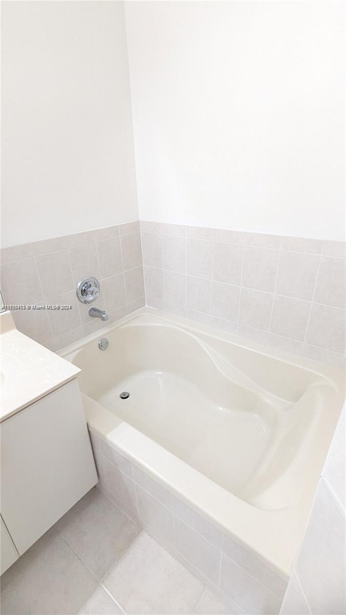 11840 Southwest 154th Avenue, Unit 11840 Miami, FL 33196 - Photo 53 of 61 a bathroom with a bathtub and shower