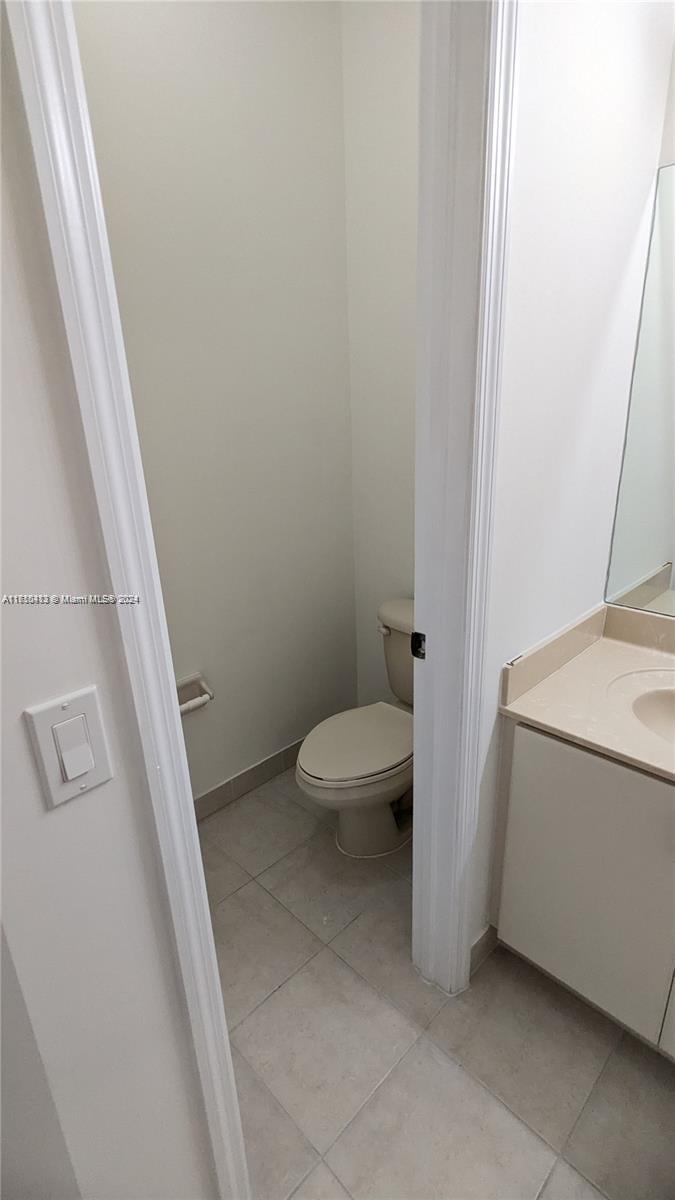 11840 Southwest 154th Avenue, Unit 11840 Miami, FL 33196 - Photo 55 of 61 a bathroom with a sink and toilet