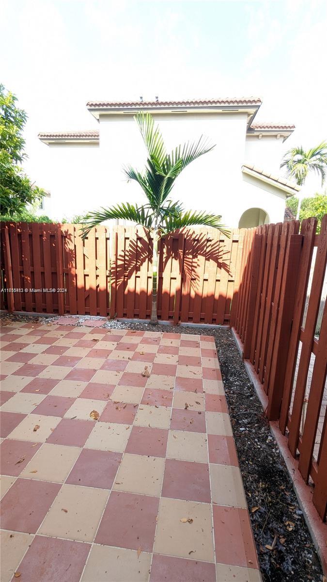 11840 Southwest 154th Avenue, Unit 11840 Miami, FL 33196 - Photo 59 of 61 a view of balcony with yard