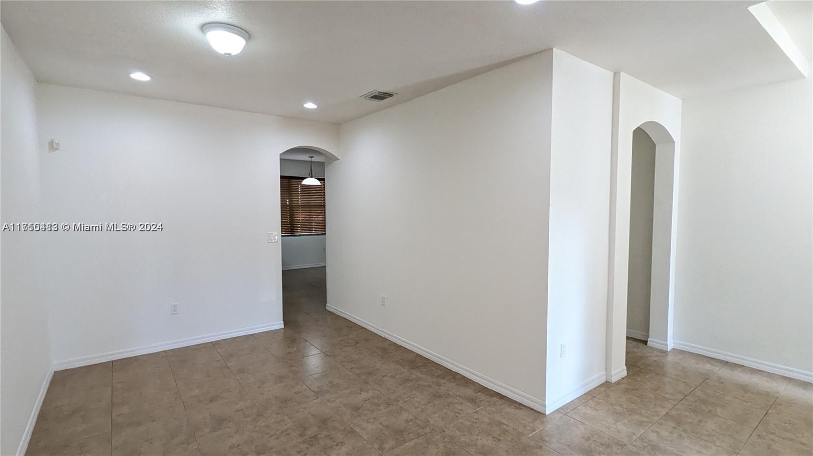 11840 Southwest 154th Avenue, Unit 11840 Miami, FL 33196 - Photo 6 of 61 an empty room with closet and wooden floor