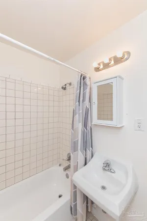 a bathroom with a sink and a bathtub