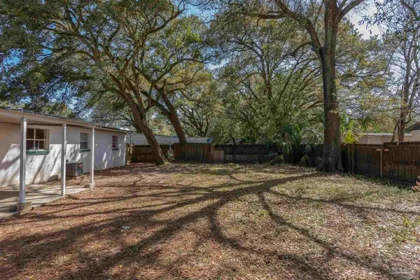 a house with trees in the background