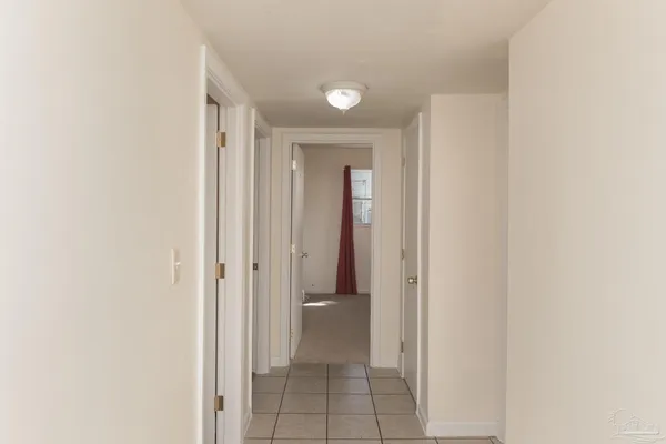 a view of a hallway with toilet