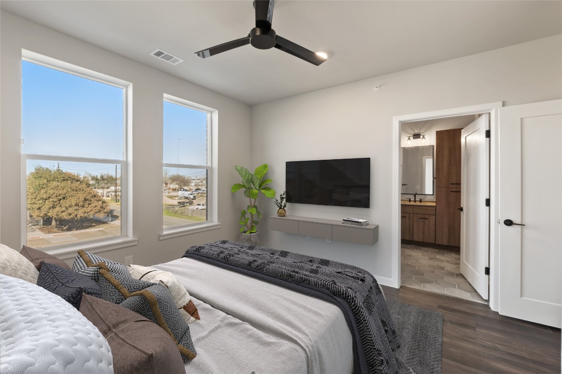 4510 Terry-O Lane, Unit 322 Austin, TX 78745 - Photo 14 of 35 a bedroom with a bed and a flat screen tv