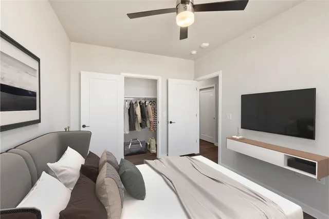 a bedroom with a large bed and a window