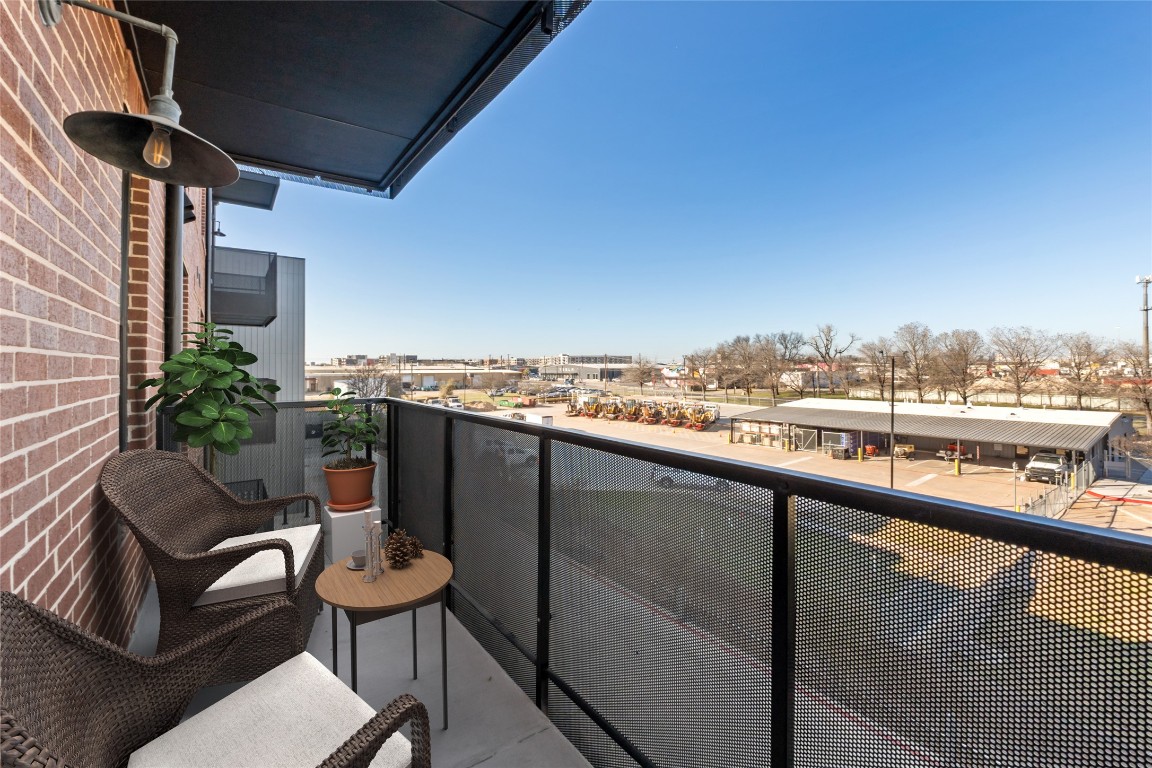 4510 Terry-O Lane, Unit 322 Austin, TX 78745 - Photo 24 of 35 a balcony with a table and chairs