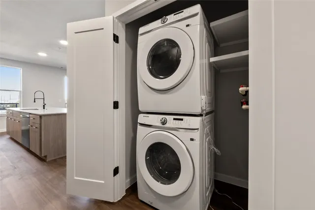 a bathroom with a refrigerator and a sink