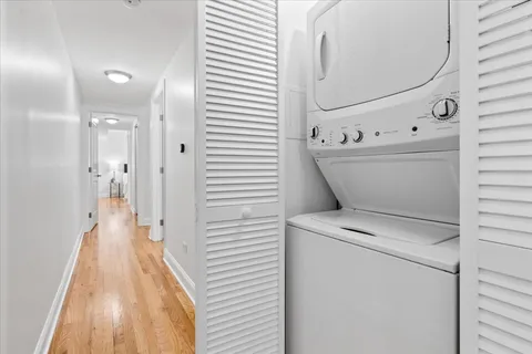 a view of a hallway with washer and dryer