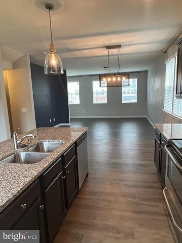 a kitchen with sink and window