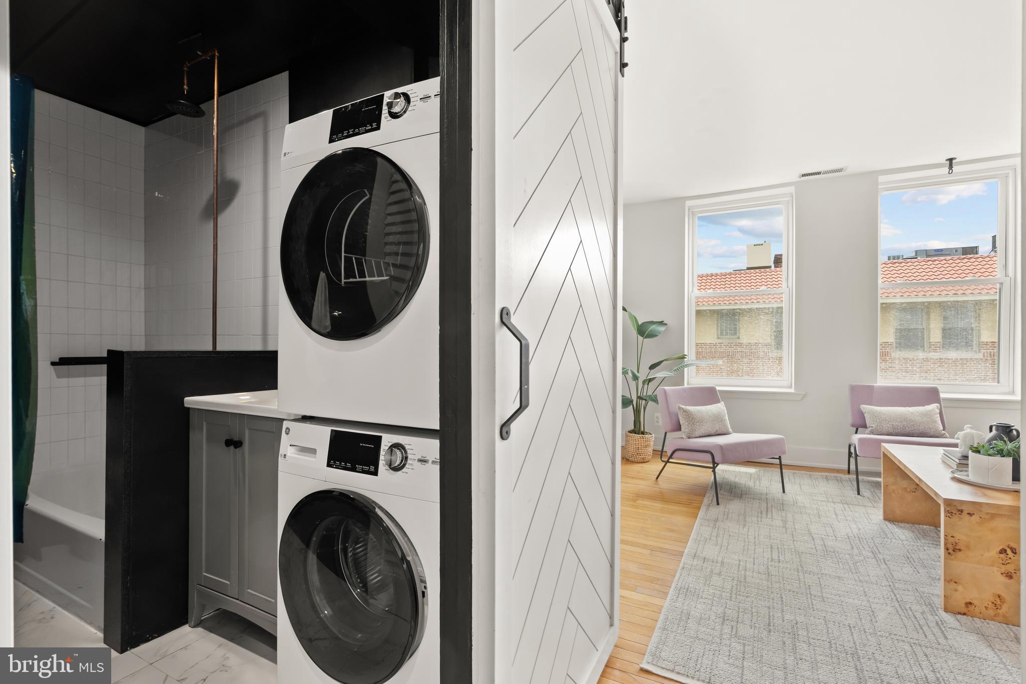 2305 18th Street Northwest, Unit 406 Washington, DC 20009 - Photo 13 of 28 a living room with furniture a rug and a fireplace