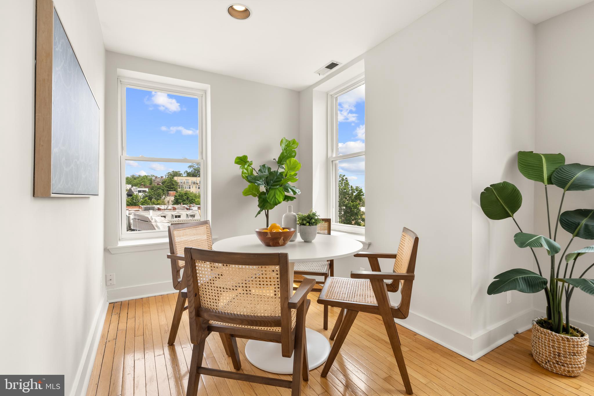 2305 18th Street Northwest, Unit 406 Washington, DC 20009 - Photo 15 of 28 a dining room with furniture and wooden floor