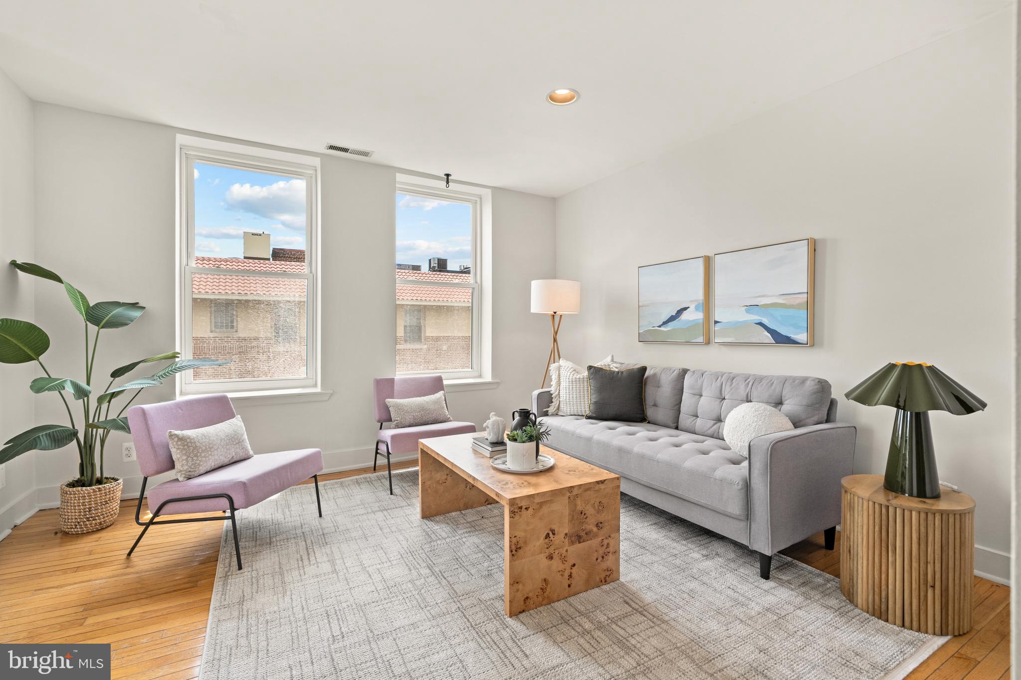 2305 18th Street Northwest, Unit 406 Washington, DC 20009 - Photo 2 of 28 a living room with furniture and wooden floor