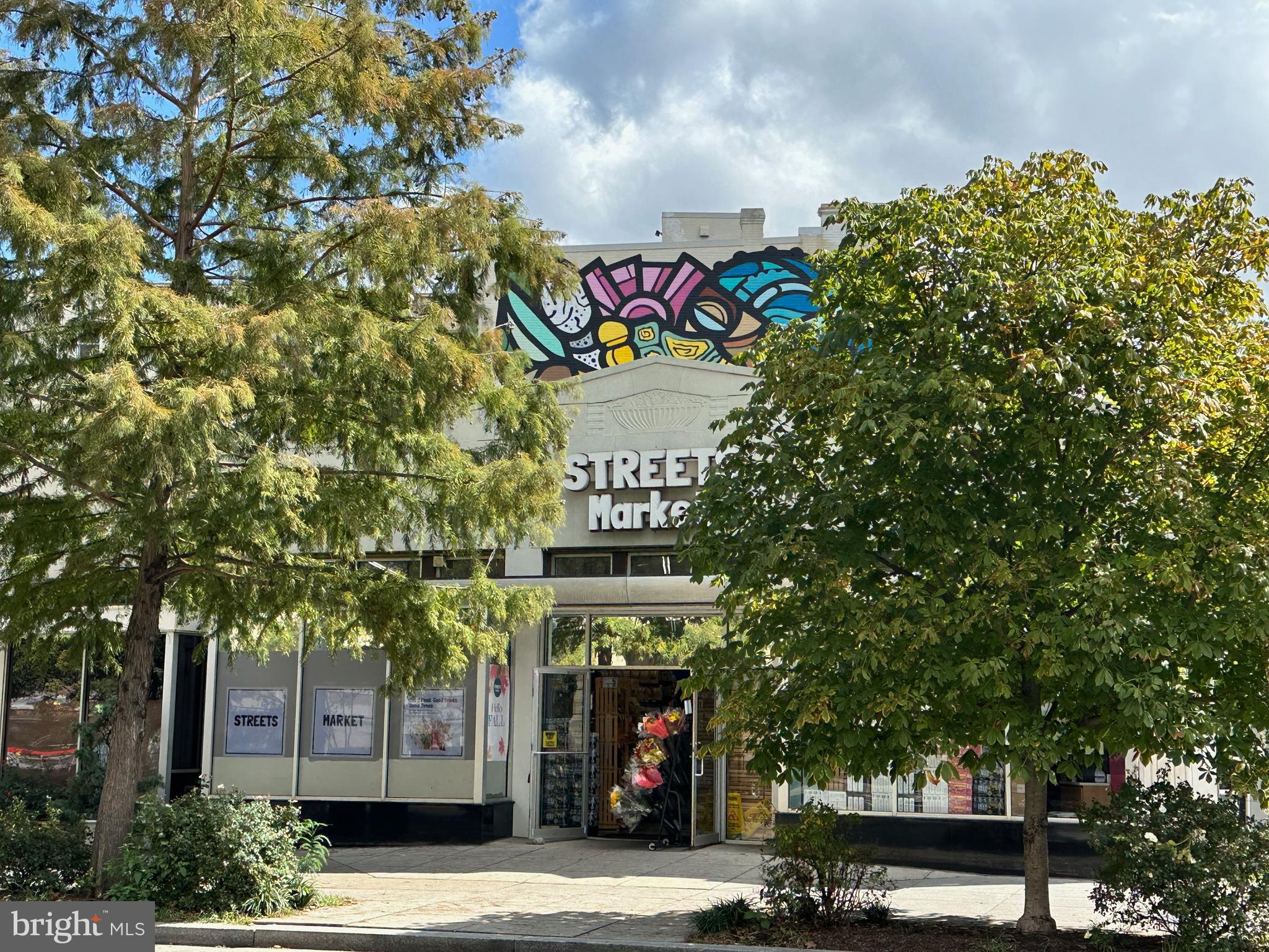 2305 18th Street Northwest, Unit 406 Washington, DC 20009 - Photo 21 of 28 a sign that is on a tree in front of it