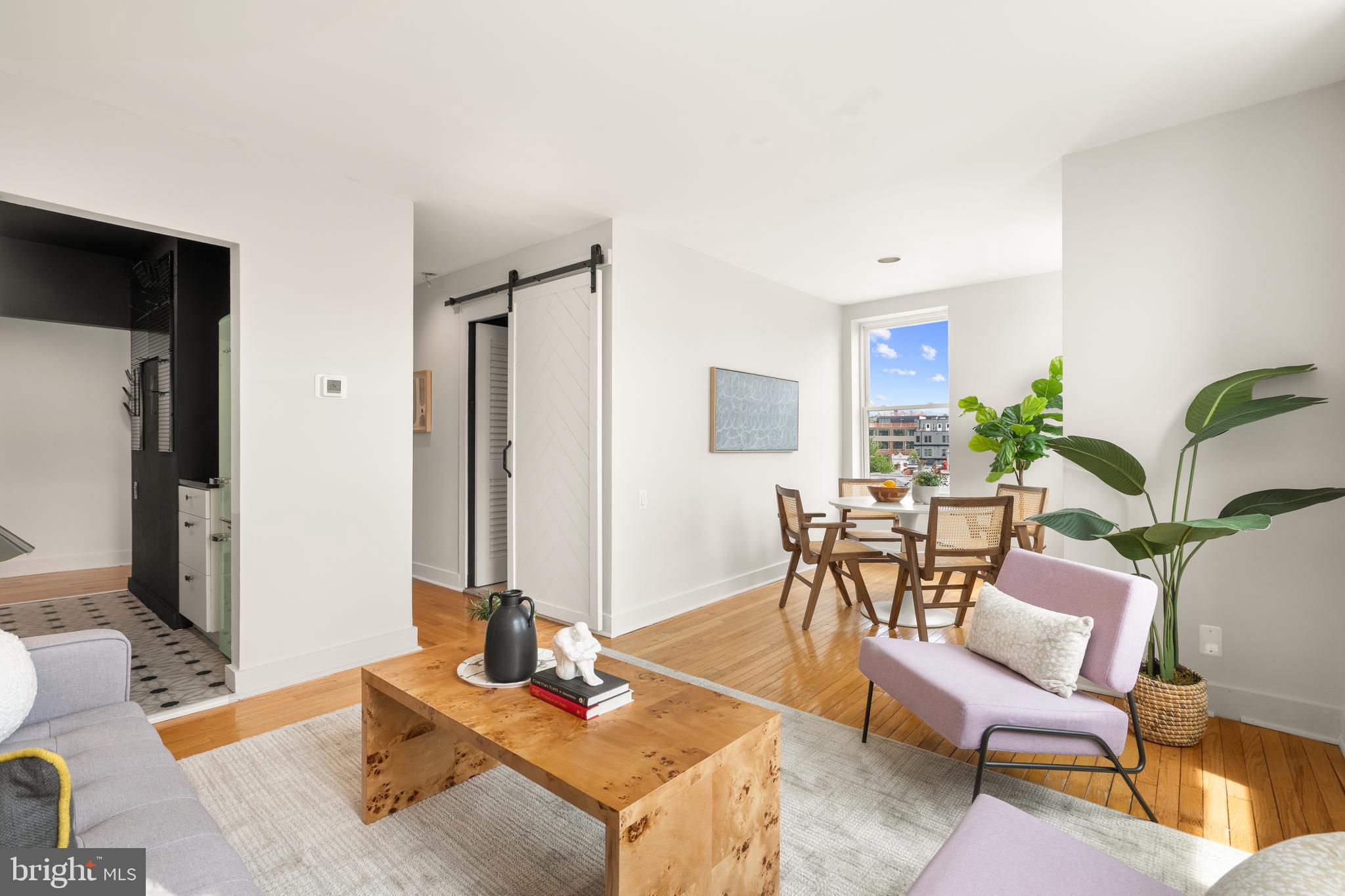 2305 18th Street Northwest, Unit 406 Washington, DC 20009 - Photo 5 of 28 a living room with furniture and wooden floor