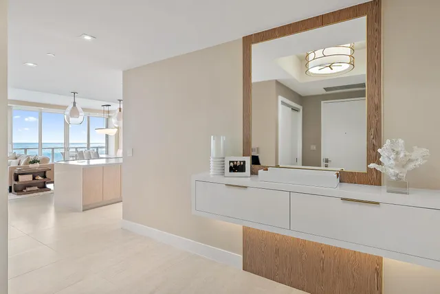 a spacious bathroom with a sink a mirror and a bathtub