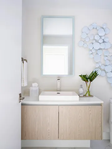 a bathroom with a sink a vanity and a mirror
