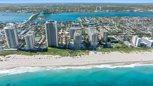 an aerial view of city and lake