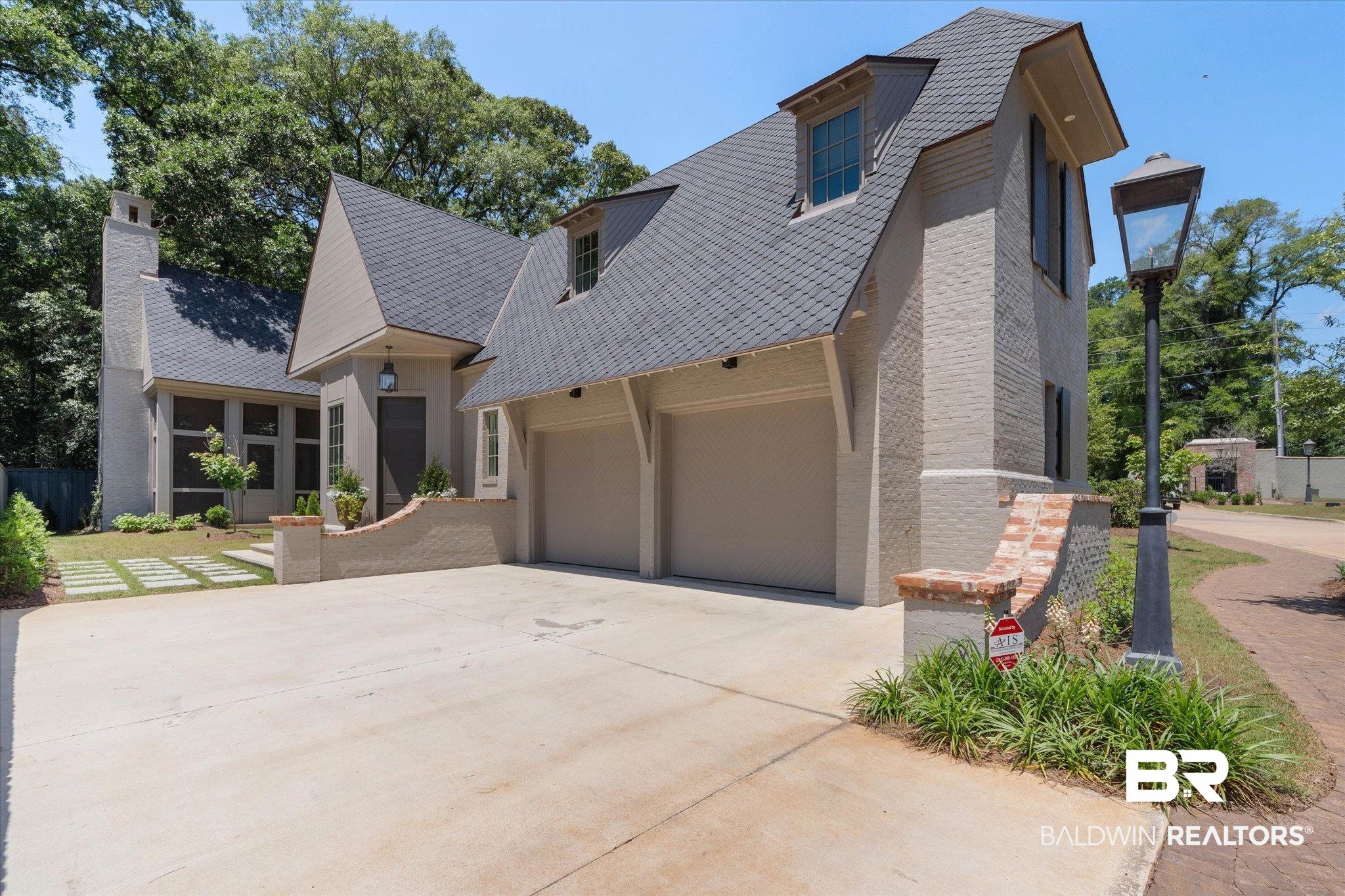 3 Canterbury Park Mobile, AL 36608 - Photo 38 of 43 View of front facade with driveway, a garage, and a chimney