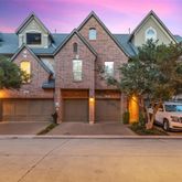a view of multiple houses with a street