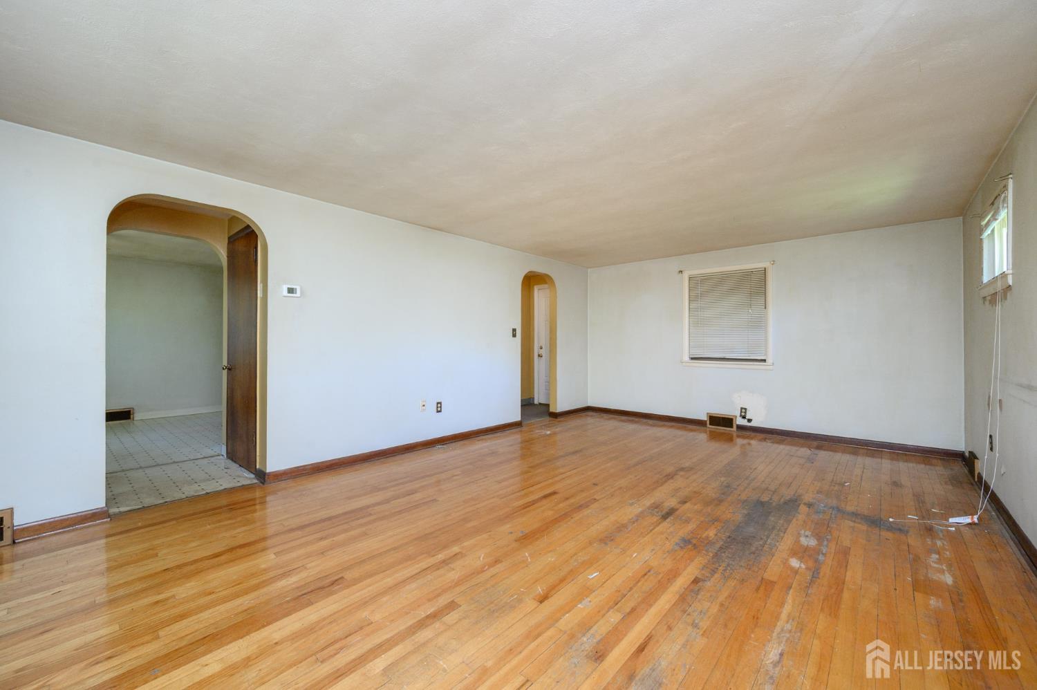 784 Yardville Hamilton Square Road Hamilton, NJ 08691 - Photo 14 of 47 a view of an empty room and wooden floor