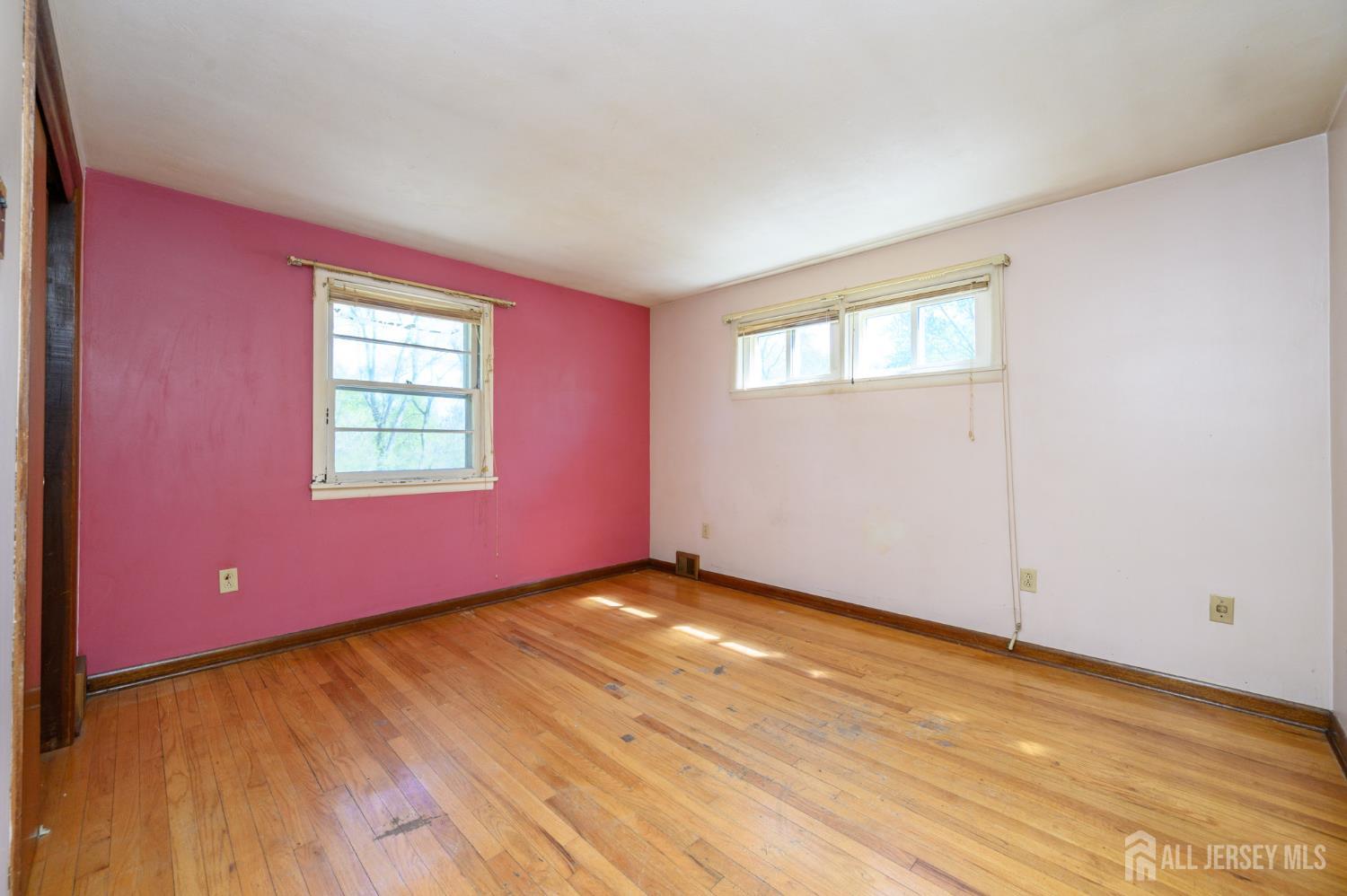784 Yardville Hamilton Square Road Hamilton, NJ 08691 - Photo 15 of 47 an empty room with wooden floor and windows