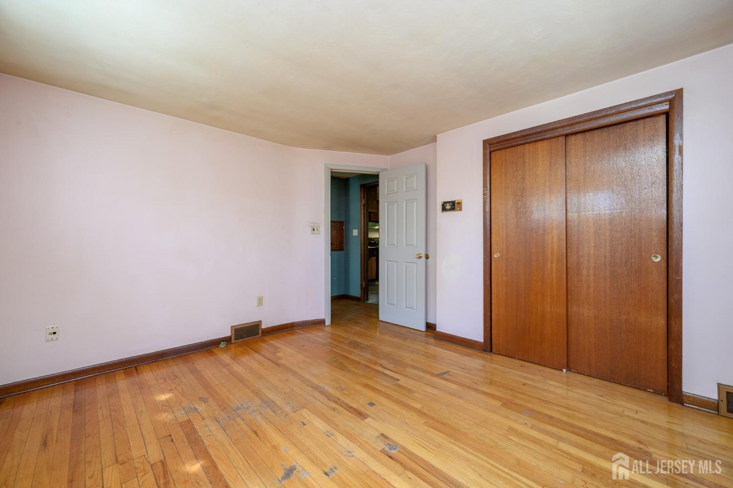 784 Yardville Hamilton Square Road Hamilton, NJ 08691 - Photo 16 of 47 a view of an empty room with wooden floor