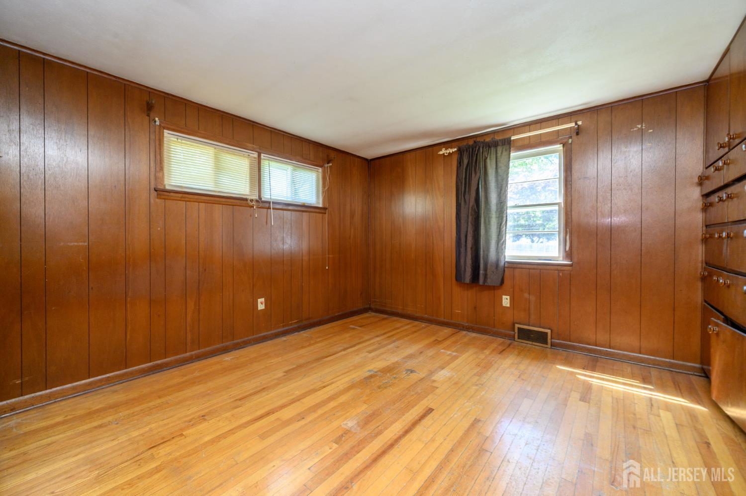 784 Yardville Hamilton Square Road Hamilton, NJ 08691 - Photo 18 of 47 an empty room with wooden floor and windows