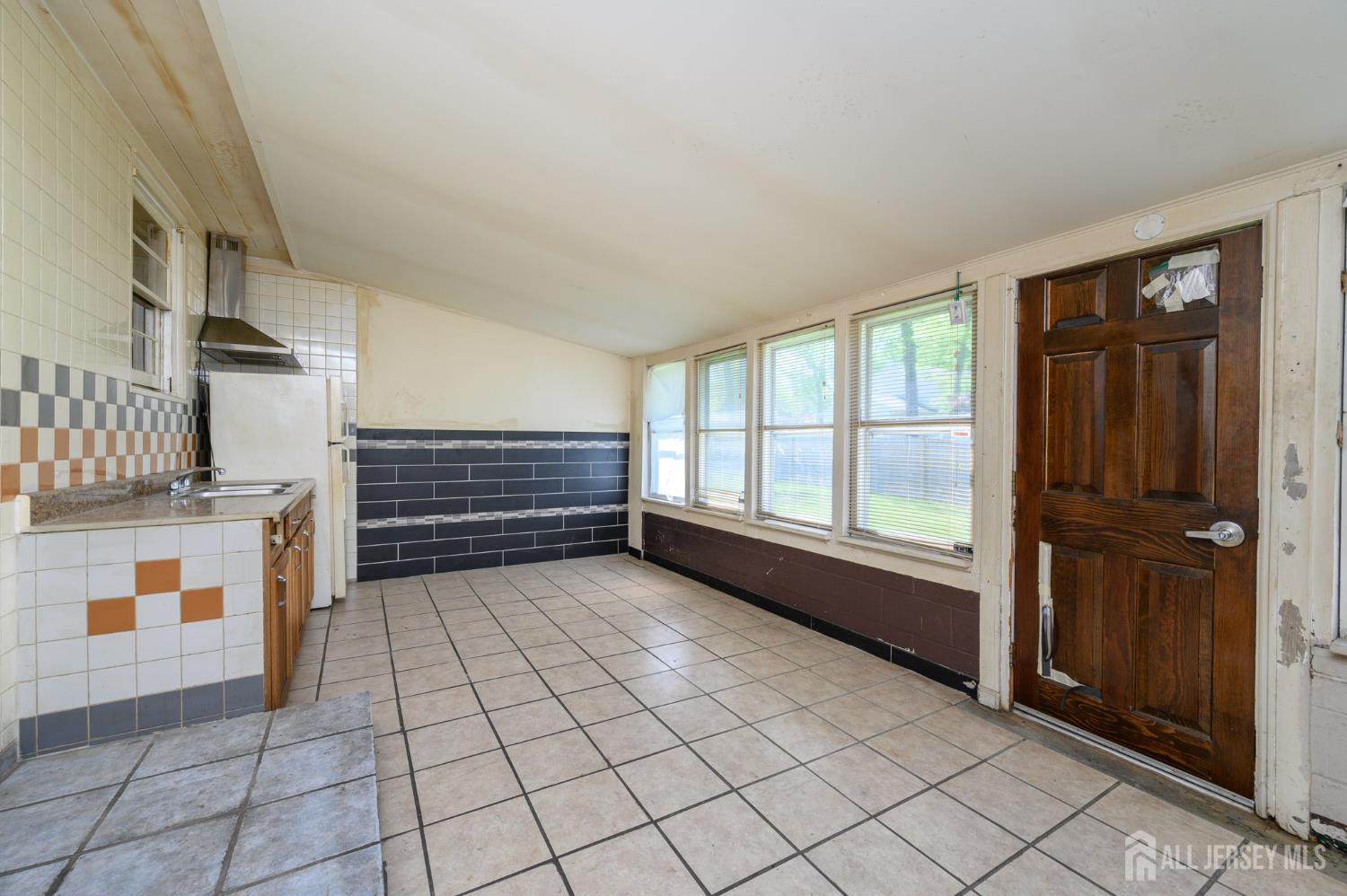 784 Yardville Hamilton Square Road Hamilton, NJ 08691 - Photo 20 of 47 a view of empty room with wooden floor and windows