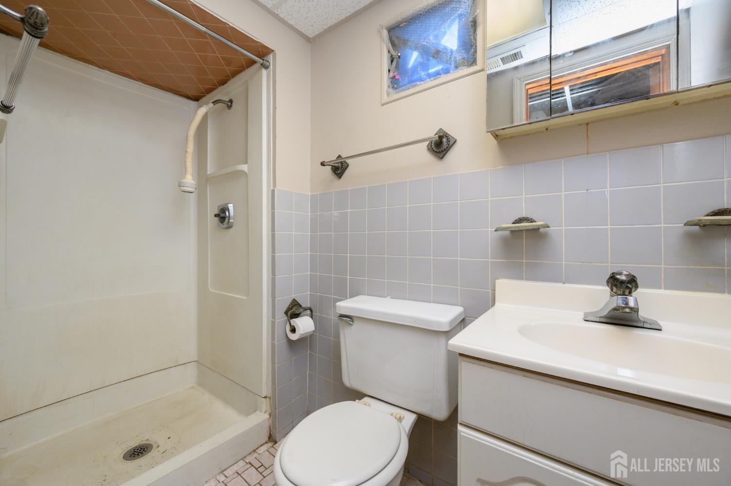 784 Yardville Hamilton Square Road Hamilton, NJ 08691 - Photo 23 of 47 a bathroom with a sink a toilet and shower