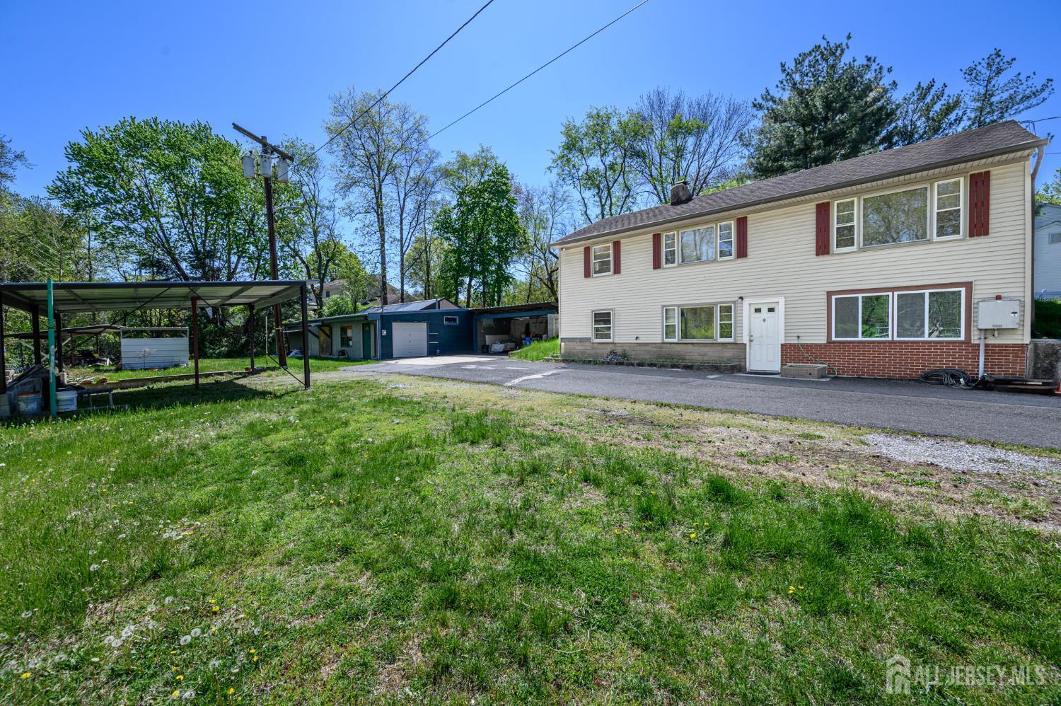 784 Yardville Hamilton Square Road Hamilton, NJ 08691 - Photo 40 of 47 a view of a house with a yard and sitting area