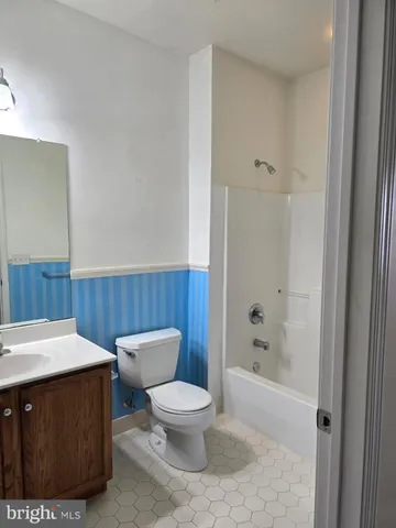 a bedroom with a bed and dresser