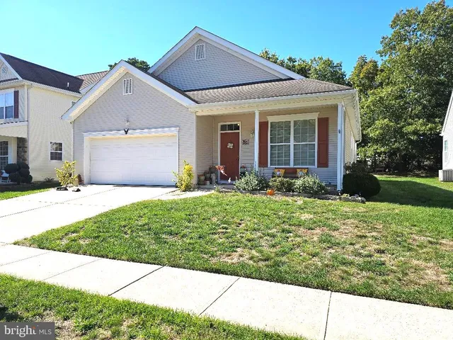 a backyard of a house with outdoor seating