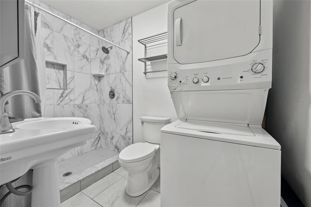 601 Northwest 36th Drive Gainesville, FL 32607 - Photo 14 of 36 a white toilet sitting next to a bathroom sink