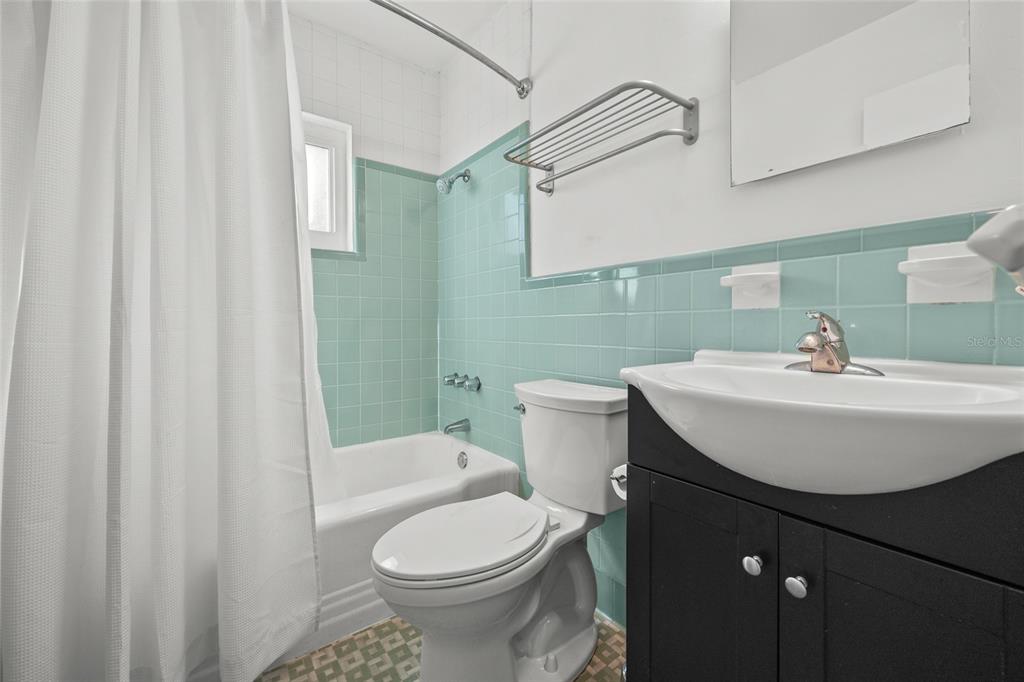 601 Northwest 36th Drive Gainesville, FL 32607 - Photo 15 of 36 a bathroom with a sink a toilet and shower