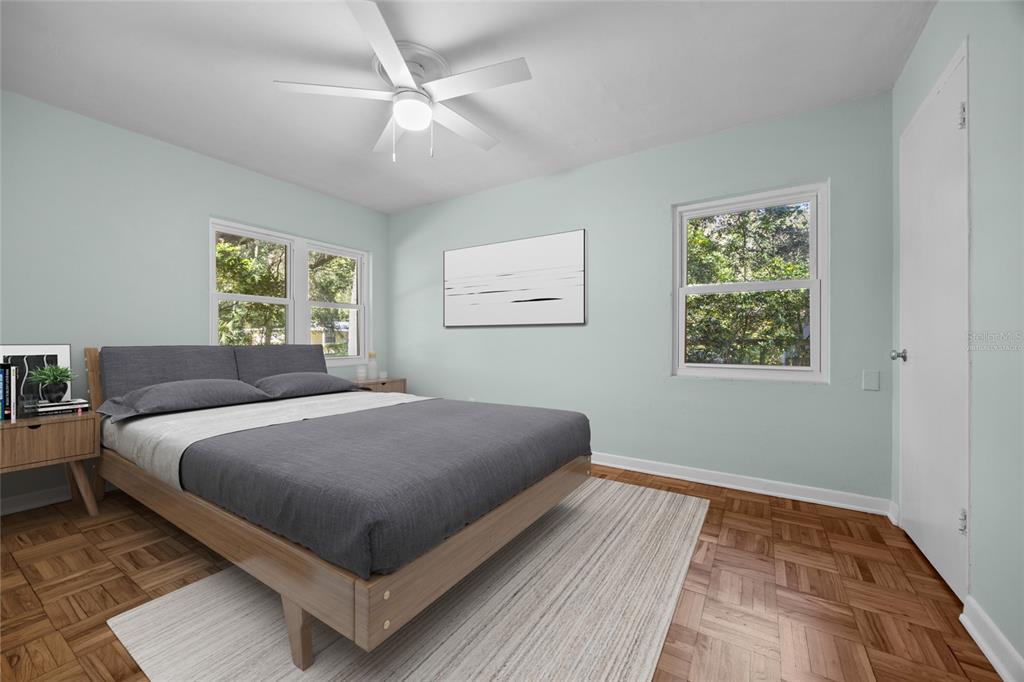 601 Northwest 36th Drive Gainesville, FL 32607 - Photo 18 of 36 a bedroom with a large bed and a window